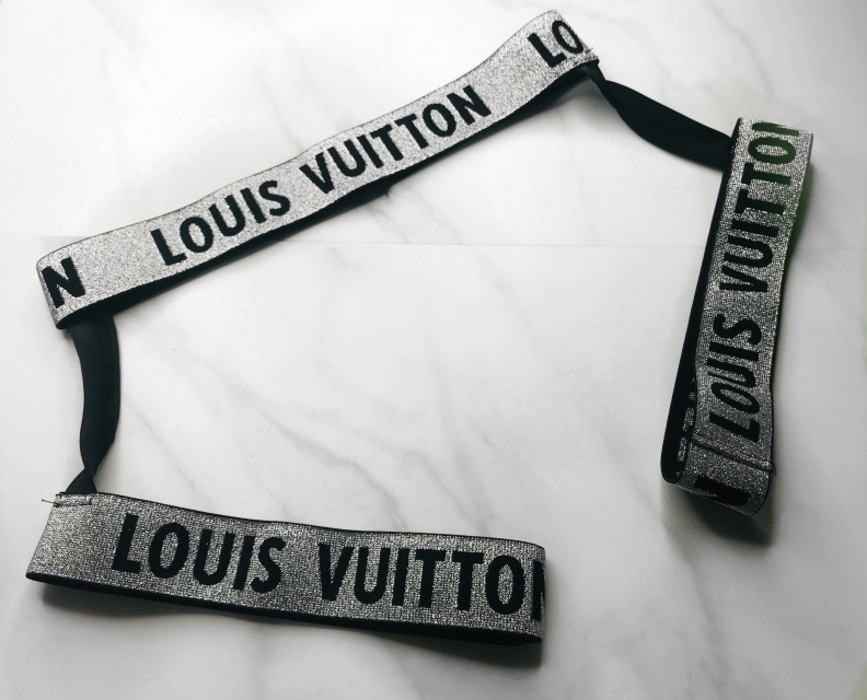 white and silver lv belt